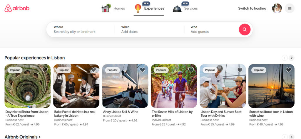 Airbnb Experiences page showing popular experiences in Lisbon, including tours, cooking classes, sailing trips, and e-bike rides.