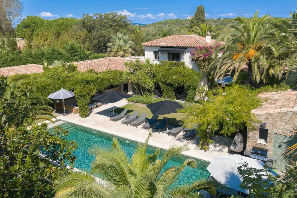 Aerial view of Bo House Villa 23 in Saint-Tropez showing infinity pool, Mediterranean garden, and luxury outdoor living areas