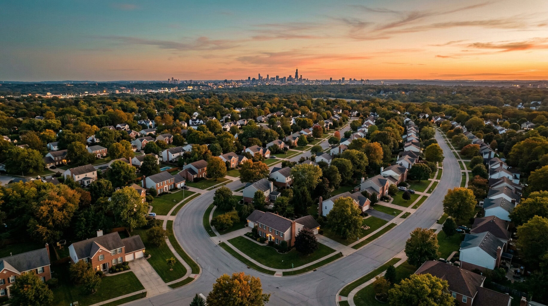 Aerial view of American residential neighbourhood at golden hour with city skyline — new short-term rental laws 2026