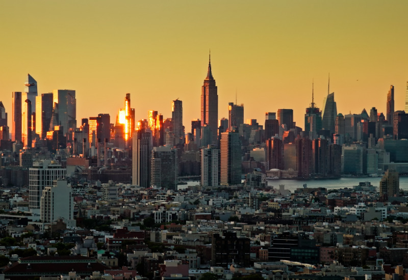 Classic New York City apartment buildings, representing the manual, investigable enforcement of Local Law 18 short-term rental compliance.