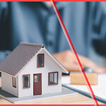 A focused hand signing a document next to a detailed model house, confirming a √ Checkable (SB 346/EU 2024/1028) short-term rental compliance status.