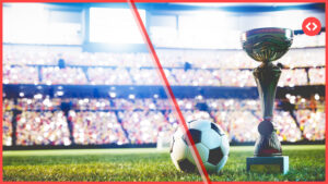 Home 17 A soccer ball and championship trophy sit on a stadium pitch with a packed, blurred crowd in the stands, representing FIFA World Cup 2026 vacation rental demand