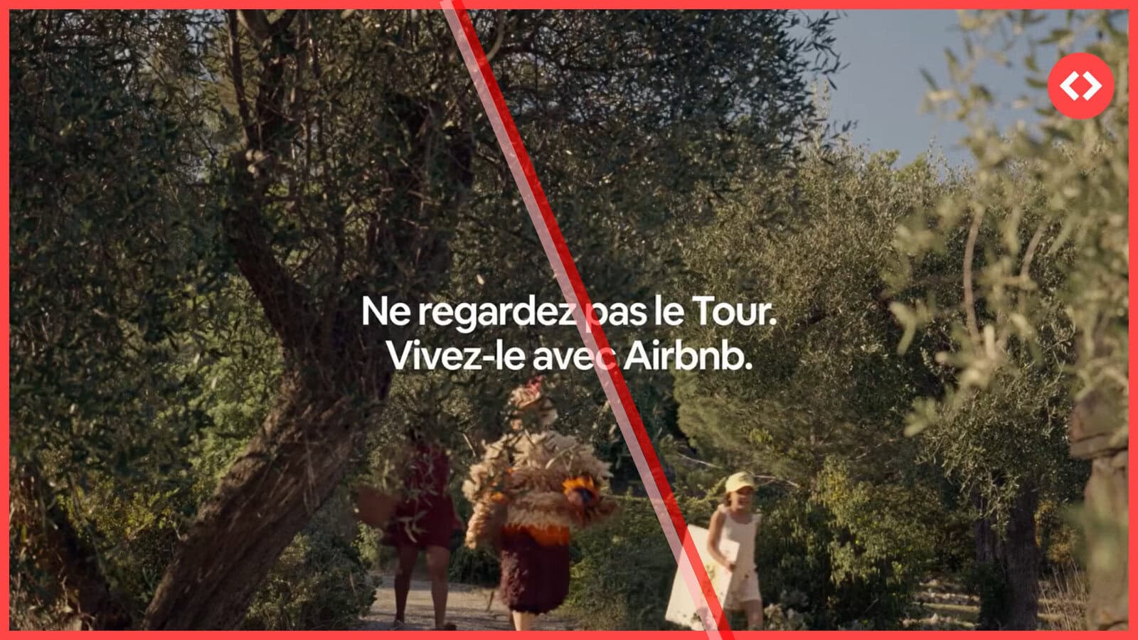 A screenshot from the Airbnb Tour de France 2026 campaign ad featuring the French text "Ne regardez pas le Tour. Vivez-le avec Airbnb" (Don't watch the Tour. Live it with Airbnb.) over a scenic view of an olive grove and a family walking on a path, with the Airbnb logo in the top right corner.